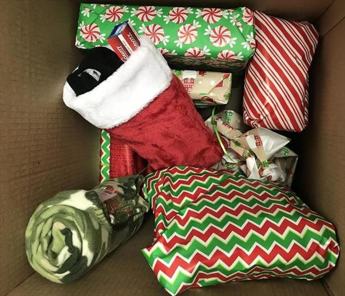 A box full of Christmas gifts.