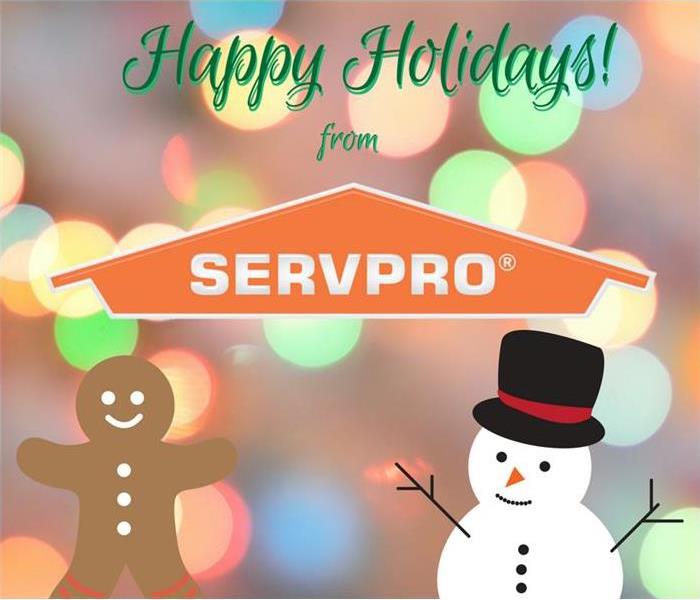 A snowman and gingerbread man with Christmas lights and a SERVPRO logo.
