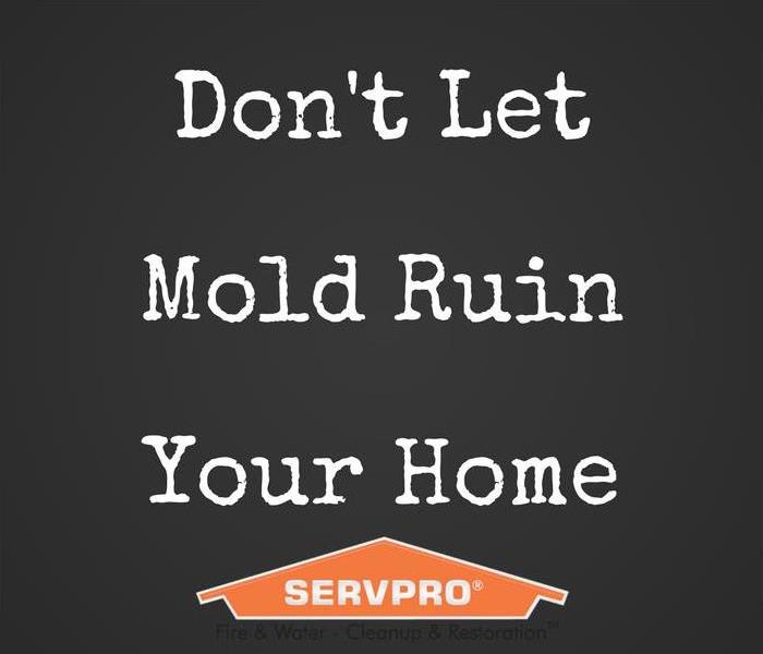 A black sign with "Don't let mold ruin your home" and a SERVPRO logo.